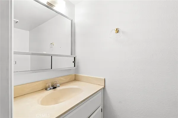 a view of a backyard with wooden fence