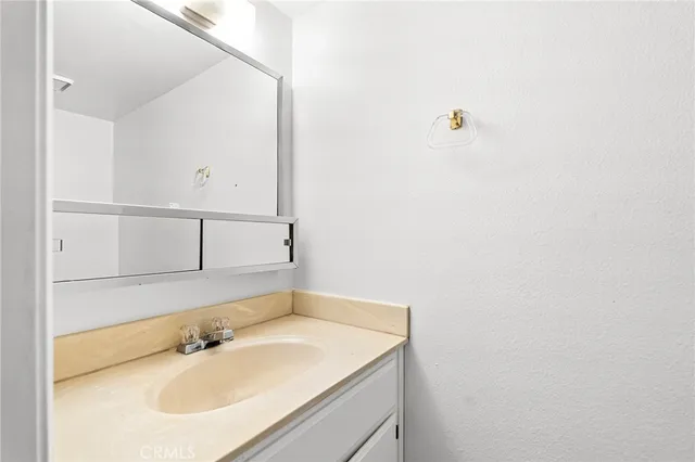 a view of a backyard with wooden fence