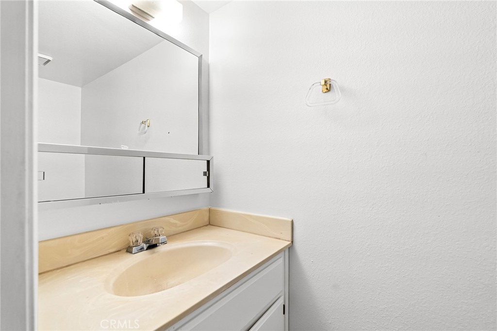585 North Street Corning, CA 96021 - Photo 23 of 41 a bathroom with a sink and a mirror