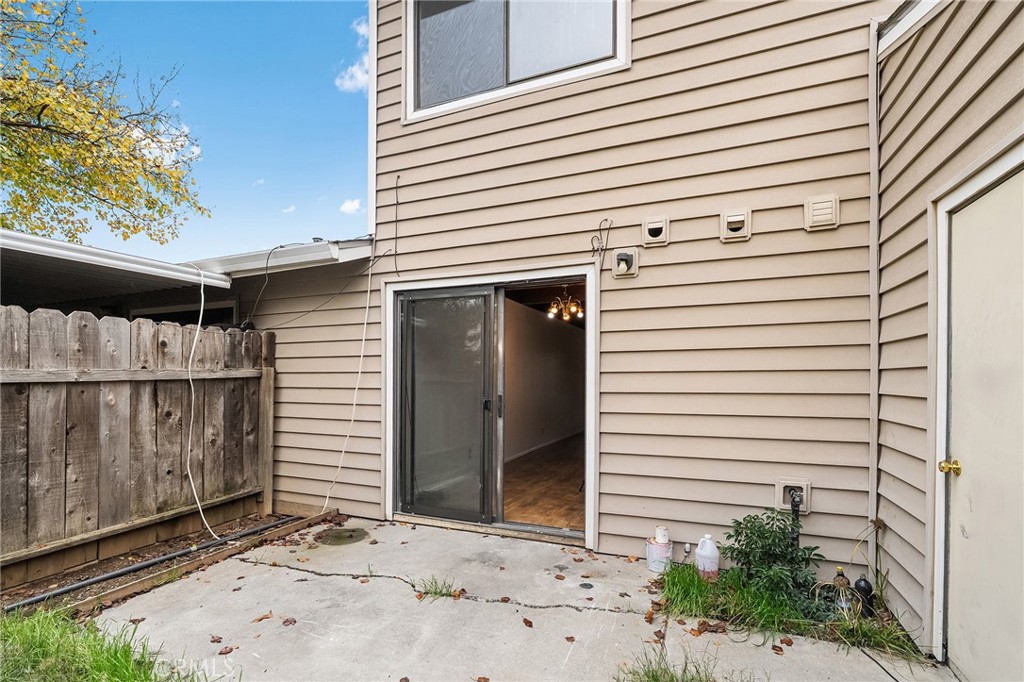 585 North Street Corning, CA 96021 - Photo 26 of 41 a view of a house with a door and wooden fence