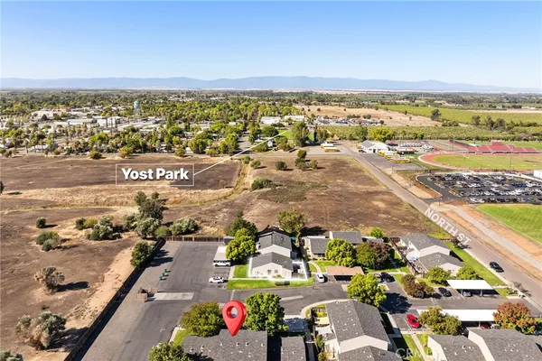 an aerial view of houses with outdoor space