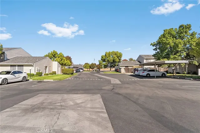 a view of street along with house and trees