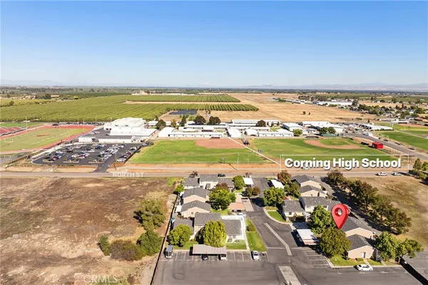 a view of a parked cars in front of a house