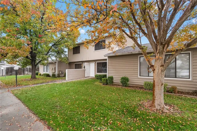 a view of a house with a yard