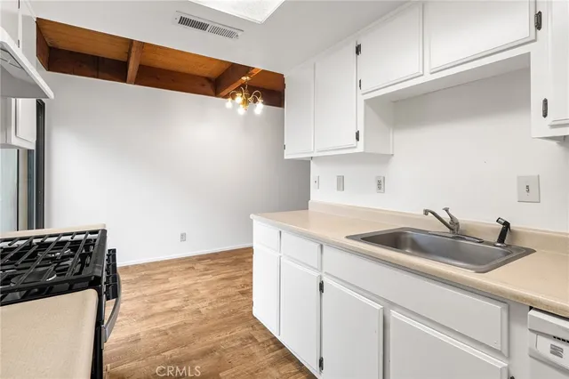 a kitchen with a sink and cabinets