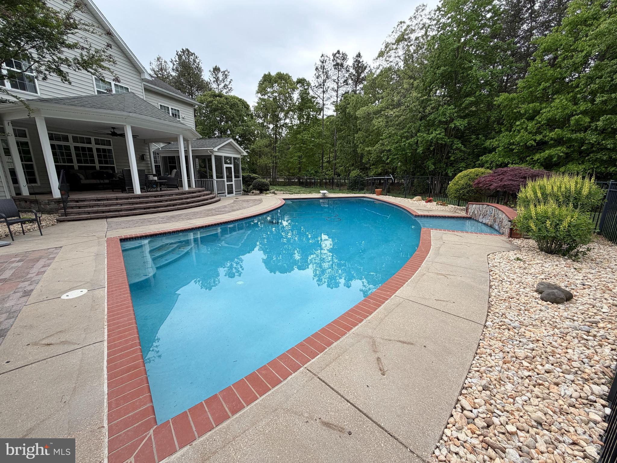 4100 Hidden Creek Road Port Republic, MD 20676 - Photo 7 of 10 Inground heated pool, stone fountain wall