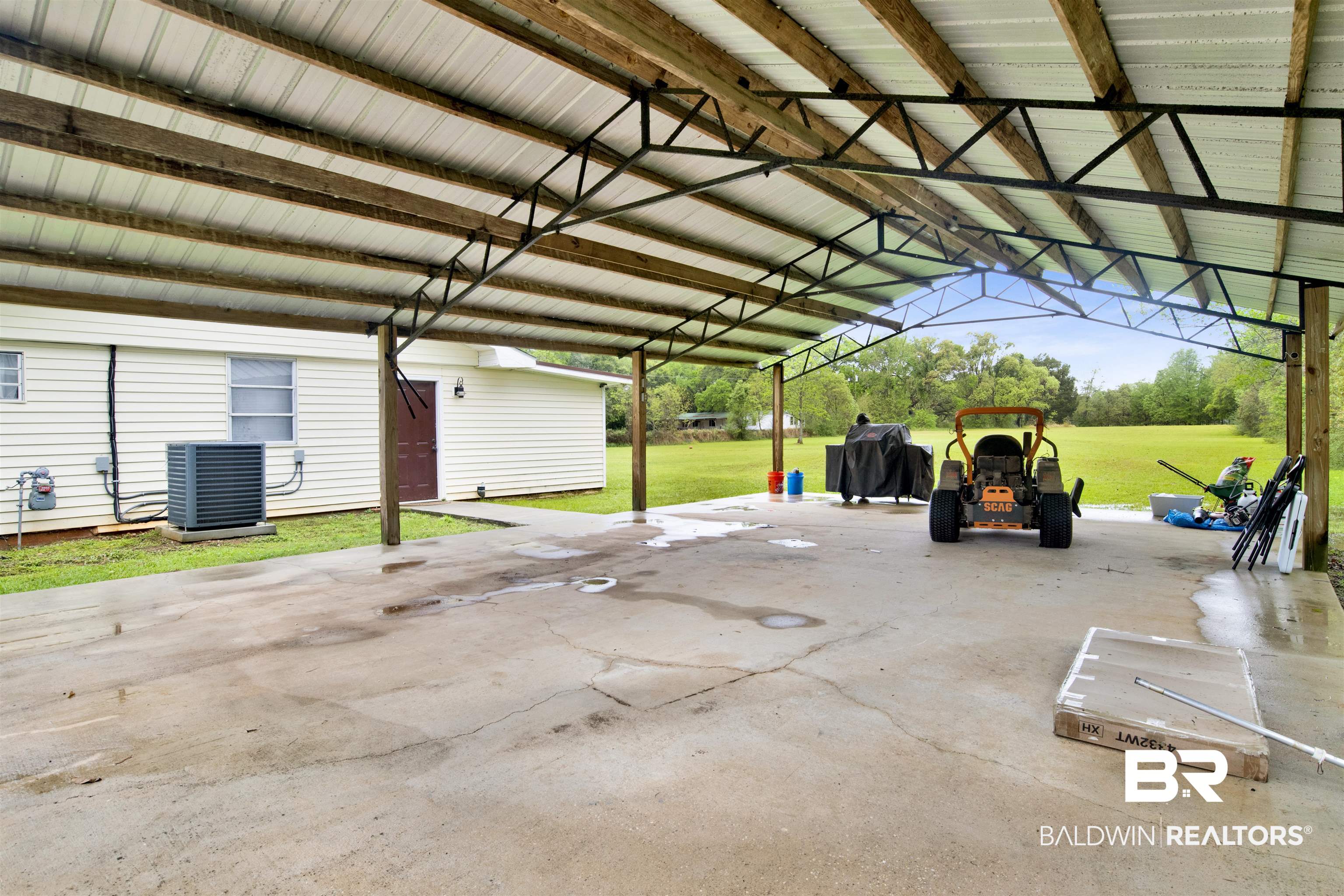 10244 Magnolia Road Irvington, AL 36544 - Photo 25 of 37 Garage with central air condition unit