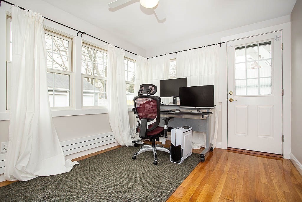 10 Standish Road Milton, MA 02186 - Photo 15 of 27 a view of a workspace with furniture and a window