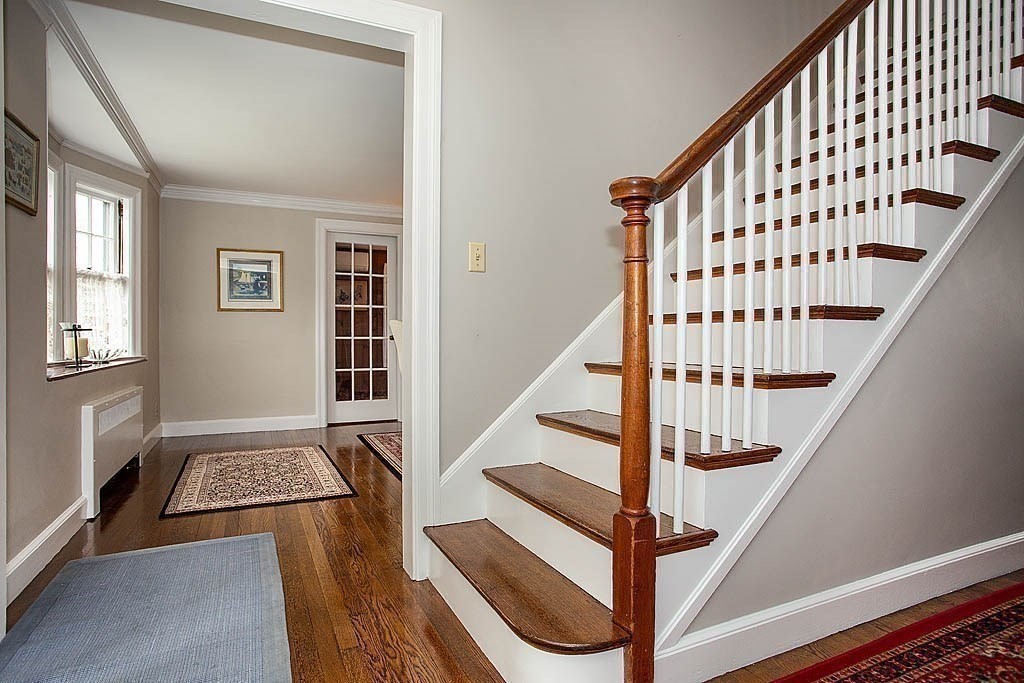 10 Standish Road Milton, MA 02186 - Photo 18 of 27 a view of entryway with wooden floor and stairs