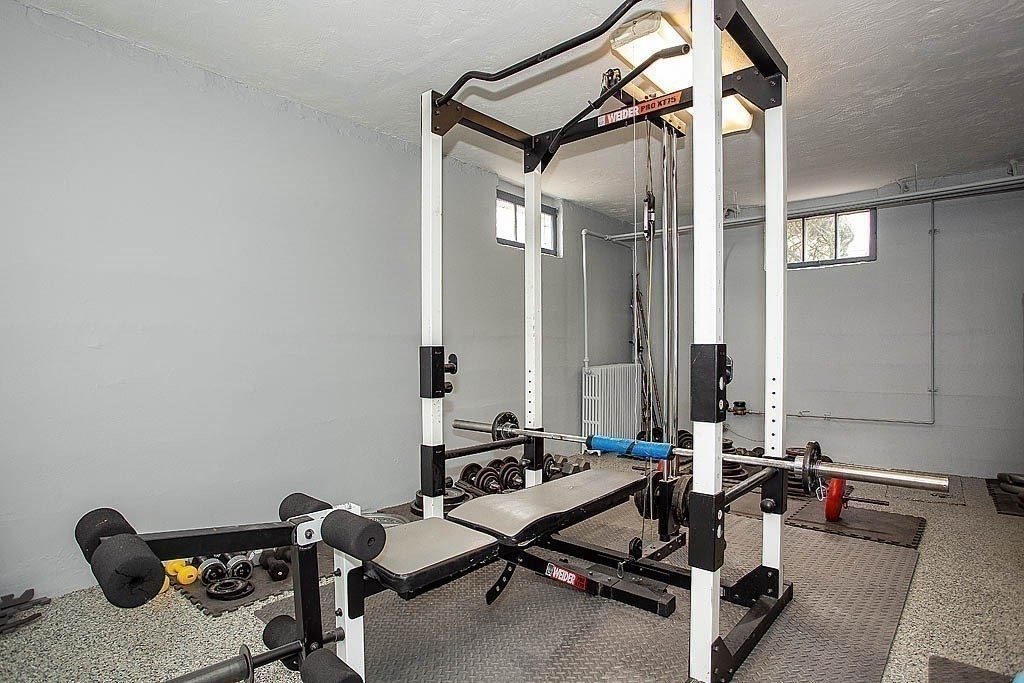 10 Standish Road Milton, MA 02186 - Photo 27 of 27 a room with gym equipment and a mirror