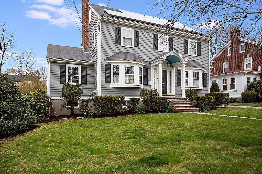 10 Standish Road Milton, MA 02186 - Photo 3 of 27 a front view of a house with a garden and patio