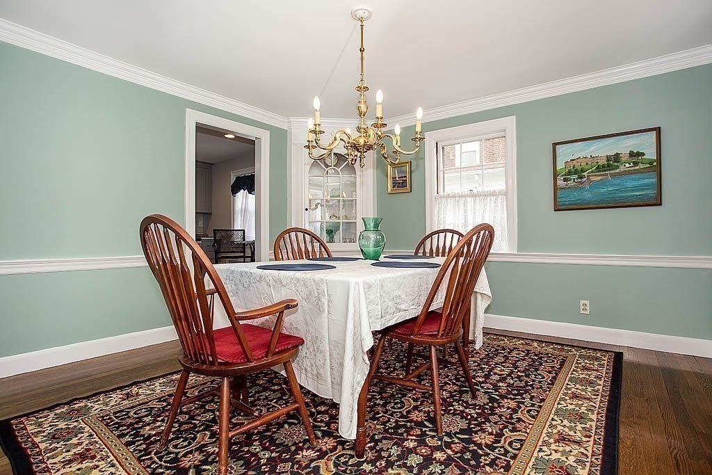 10 Standish Road Milton, MA 02186 - Photo 10 of 27 a dining room with furniture a chandelier and window