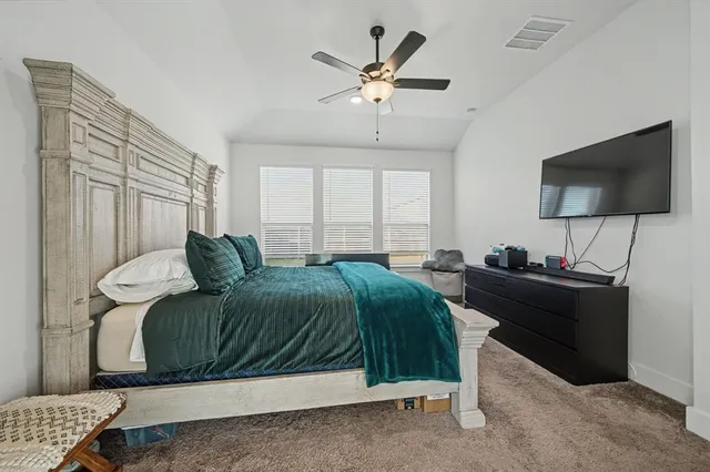 a view of a kitchen with white cabinets