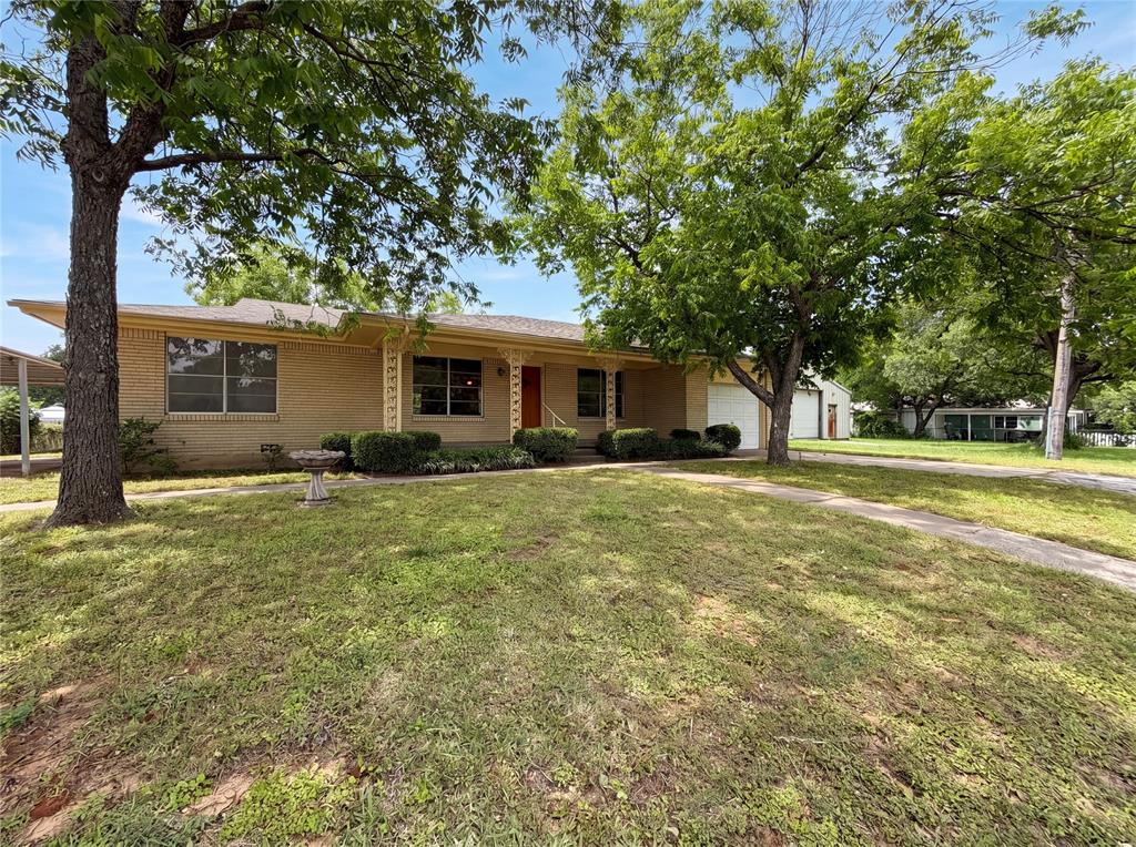 205 West Decatur Street Chico, TX 76431 - Photo 2 of 19 a front view of house with yard and green space