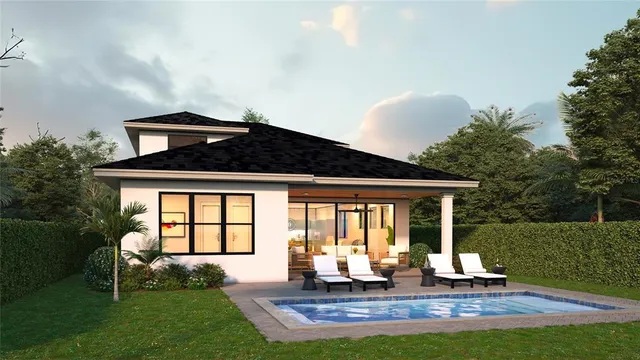 a front view of house with a garden