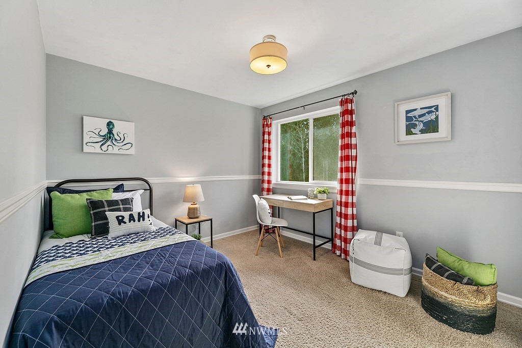 3402 Walsh Road Snohomish, WA 98290 - Photo 17 of 33 a bedroom with a bed and a potted plant