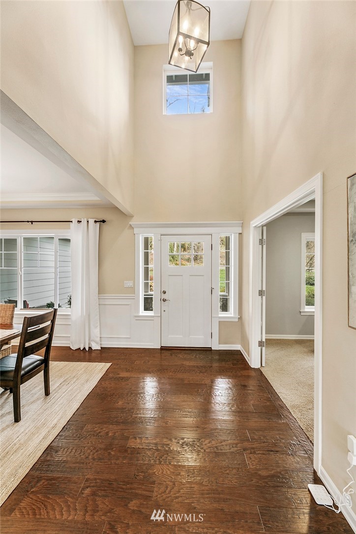 3402 Walsh Road Snohomish, WA 98290 - Photo 3 of 33 a view of an empty room with wooden floor and a window