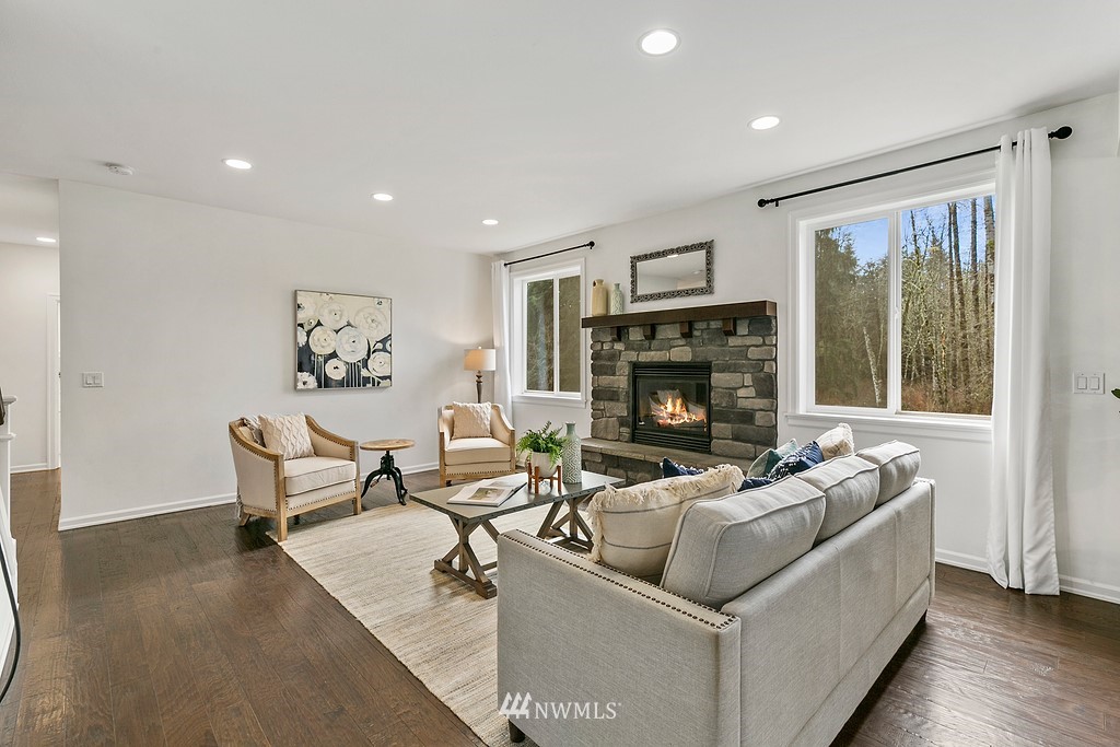 3402 Walsh Road Snohomish, WA 98290 - Photo 7 of 33 a living room with furniture and a fireplace