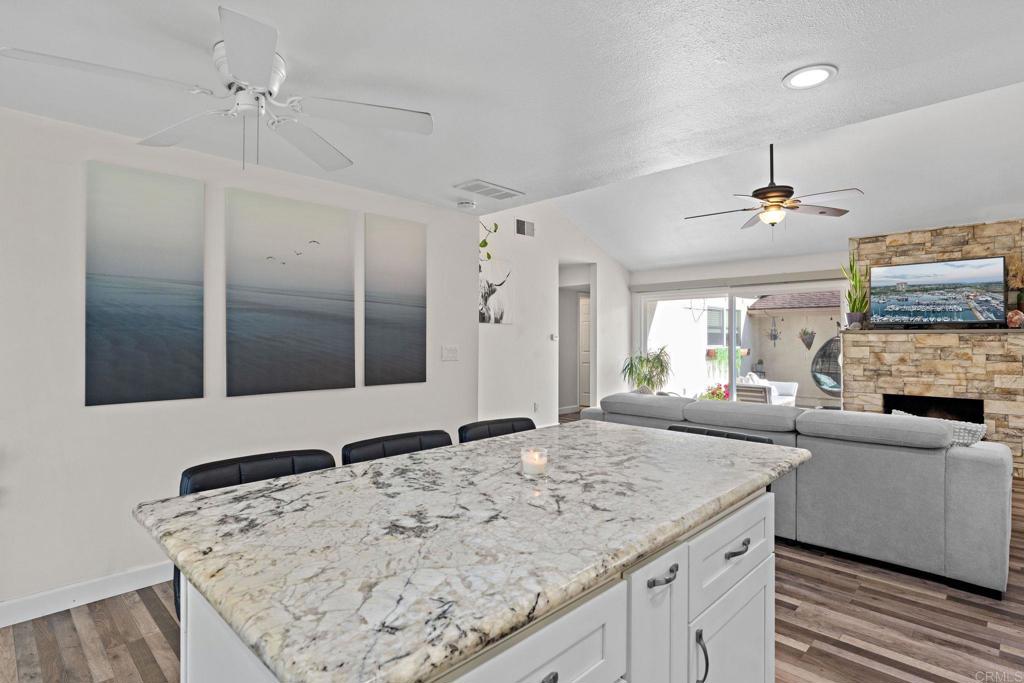 3681 Harvard Drive Oceanside, CA 92056 - Photo 12 of 30 a living room with furniture and a fireplace
