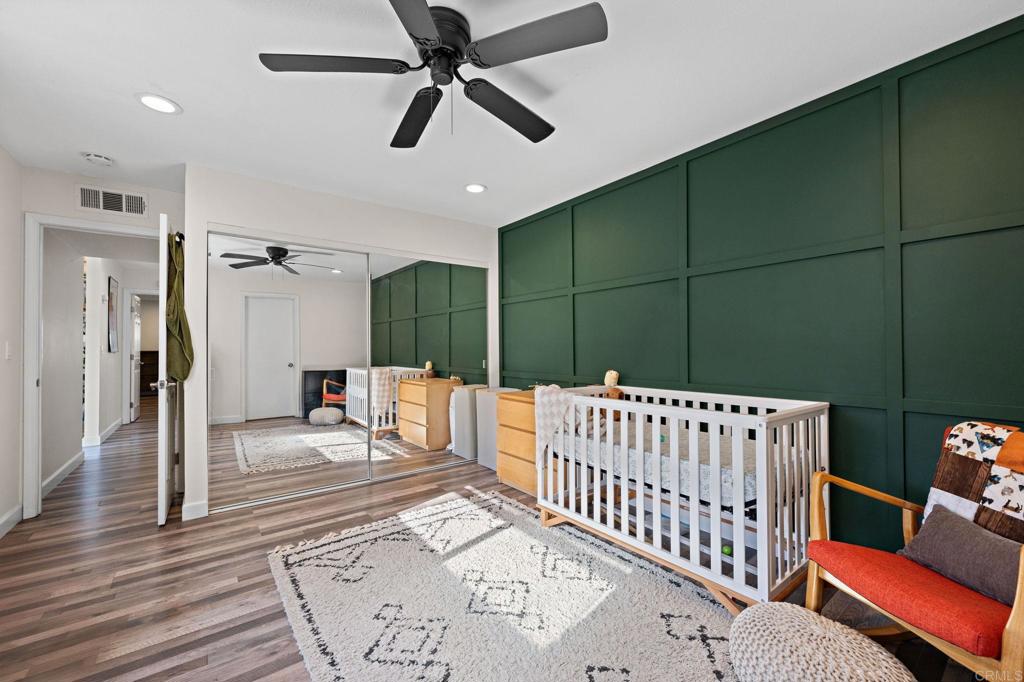 3681 Harvard Drive Oceanside, CA 92056 - Photo 14 of 30 a bedroom with furniture and a large window