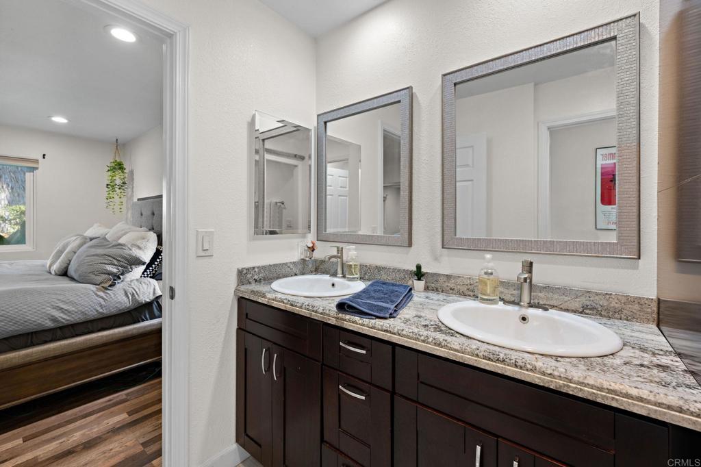 3681 Harvard Drive Oceanside, CA 92056 - Photo 19 of 30 a en suite bathroom with double sink and a mirror