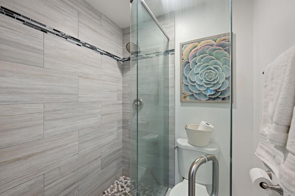 3681 Harvard Drive Oceanside, CA 92056 - Photo 20 of 30 a bathroom with a shower and toilet