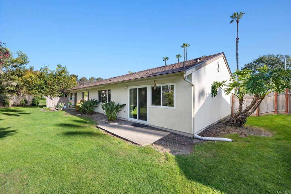 3681 Harvard Drive Oceanside, CA 92056 - Photo 22 of 30 a view of a house with a yard and a garden