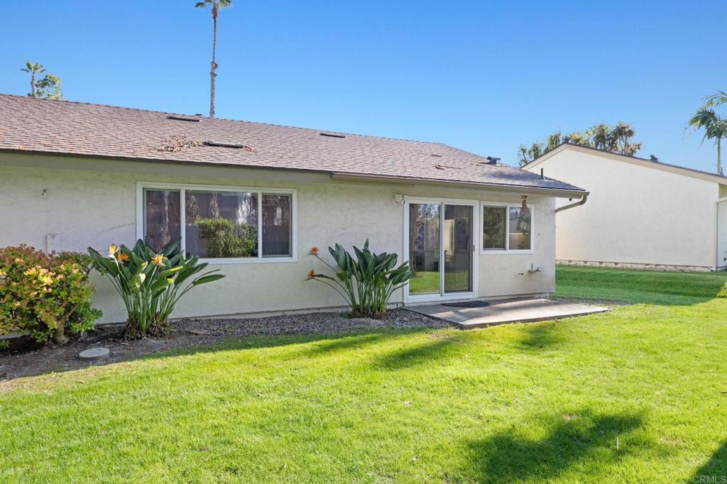 3681 Harvard Drive Oceanside, CA 92056 - Photo 23 of 30 a view of a house with swimming pool and a yard
