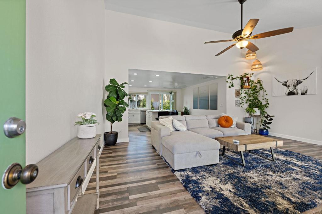 3681 Harvard Drive Oceanside, CA 92056 - Photo 3 of 30 a living room with furniture and wooden floor