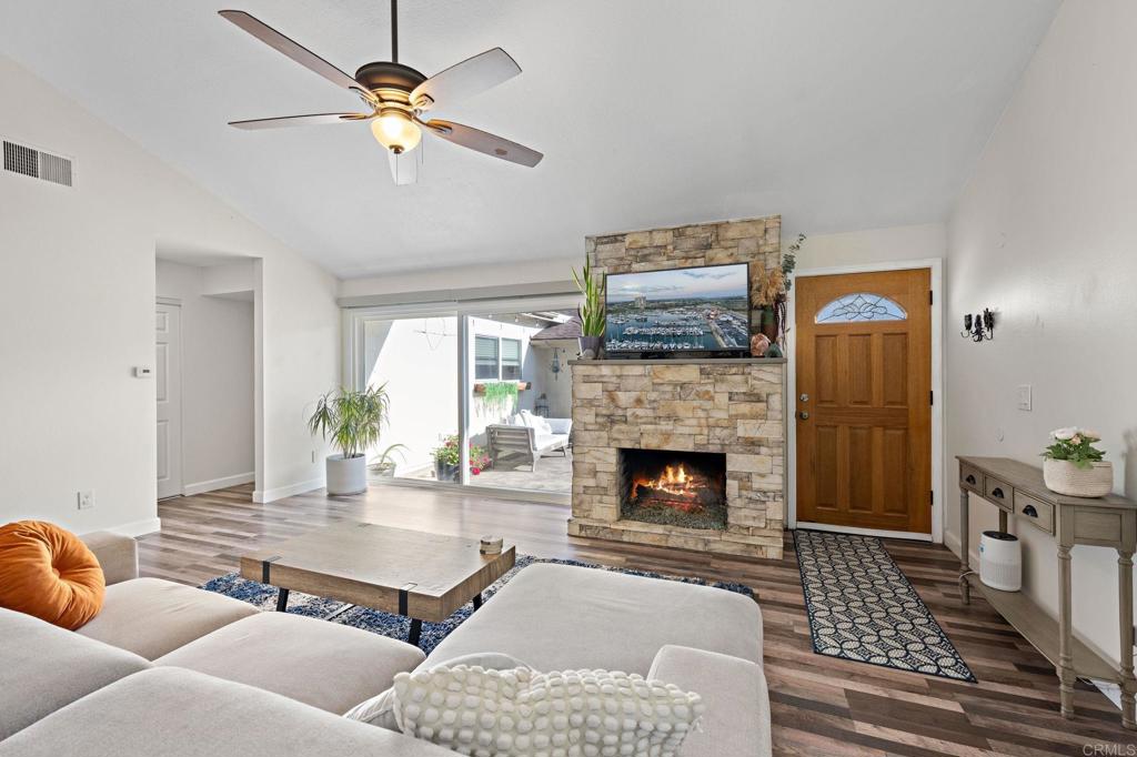3681 Harvard Drive Oceanside, CA 92056 - Photo 5 of 30 a living room with furniture and a fireplace