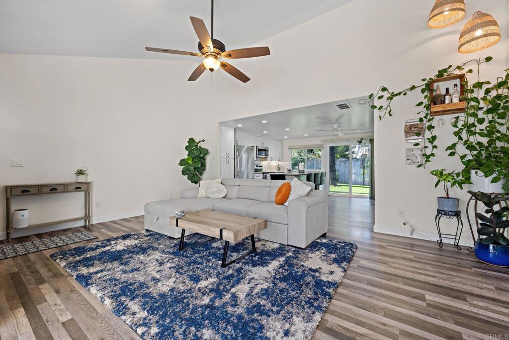 3681 Harvard Drive Oceanside, CA 92056 - Photo 7 of 30 a living room with a couch and a potted plant