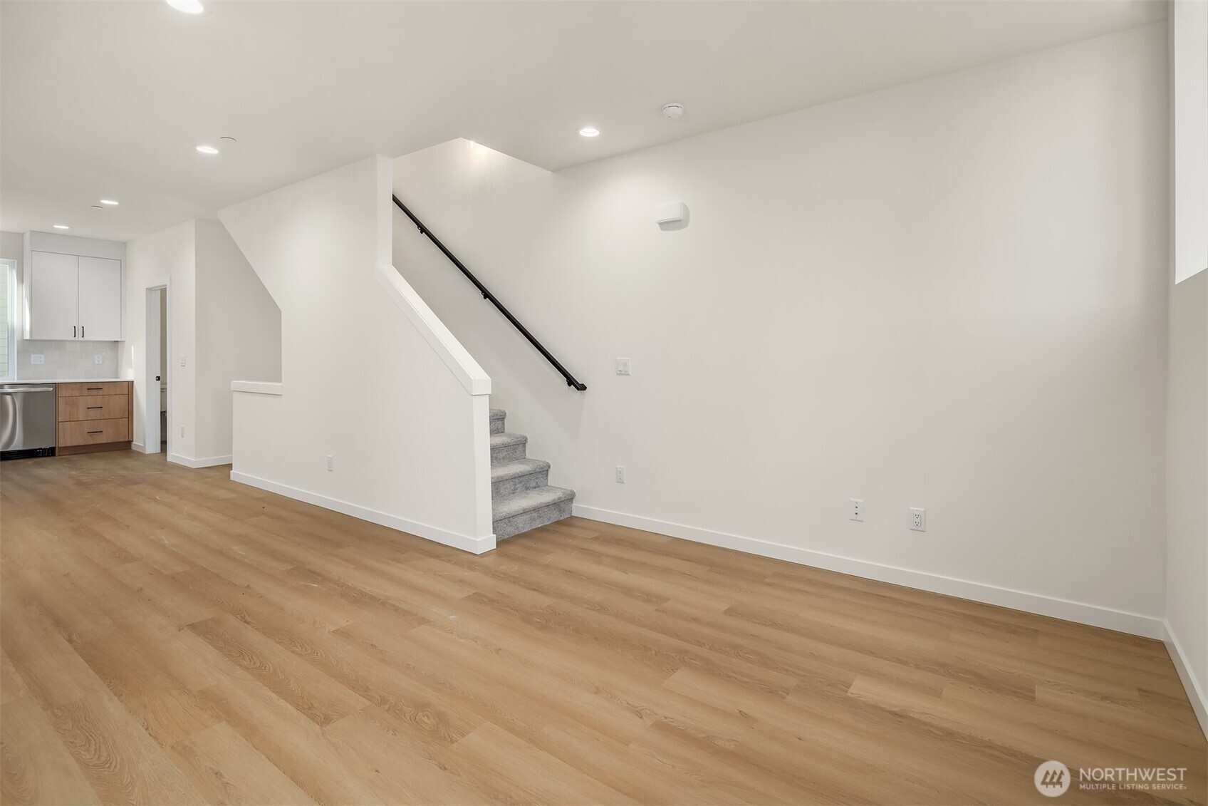 18017 2nd Avenue Northeast, Unit B Seattle, WA 98155 - Photo 11 of 19 a view of an empty room with wooden floor