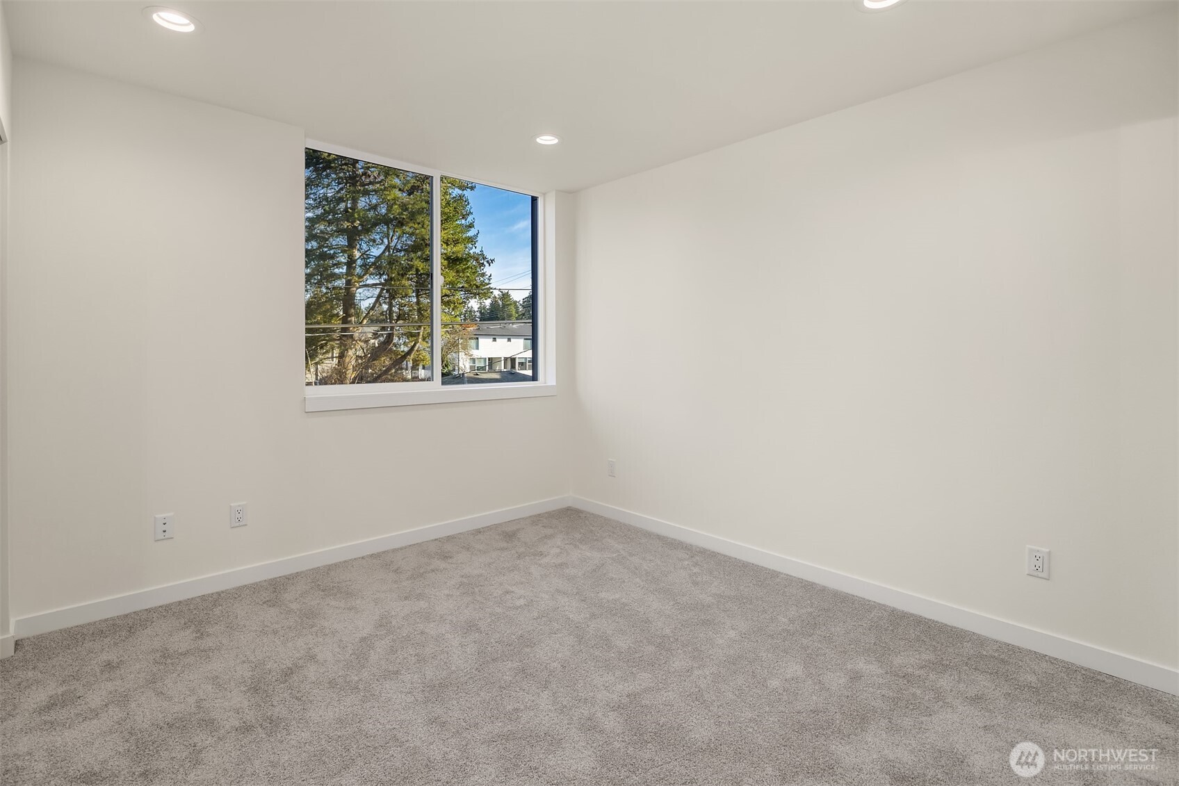 18017 2nd Avenue Northeast, Unit B Seattle, WA 98155 - Photo 13 of 19 an empty room with windows