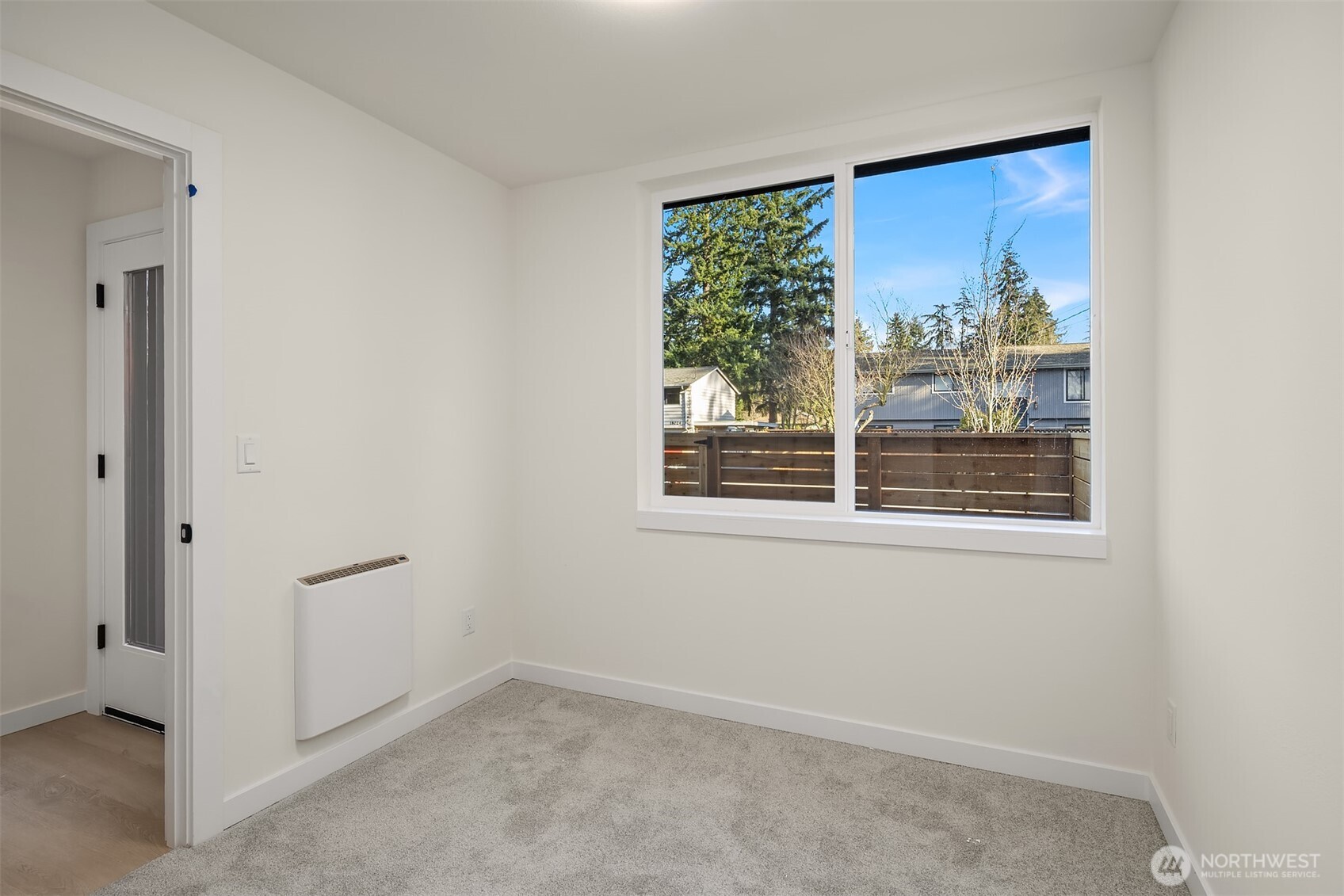 18017 2nd Avenue Northeast, Unit B Seattle, WA 98155 - Photo 17 of 19 an empty room with windows