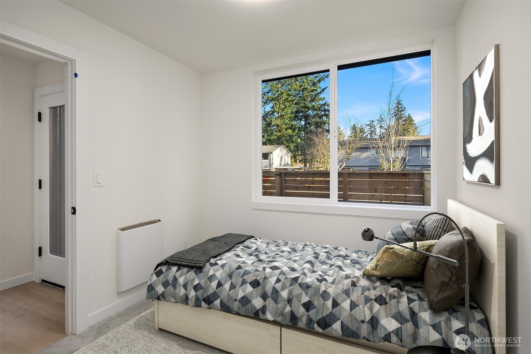 18017 2nd Avenue Northeast, Unit B Seattle, WA 98155 - Photo 18 of 19 a bedroom with a bed and a window