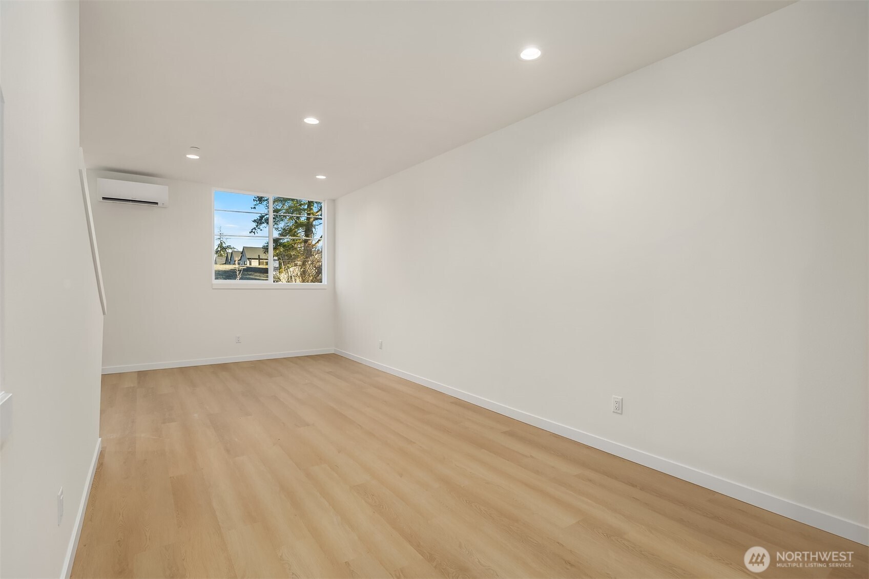18017 2nd Avenue Northeast, Unit B Seattle, WA 98155 - Photo 5 of 19 an empty room with windows