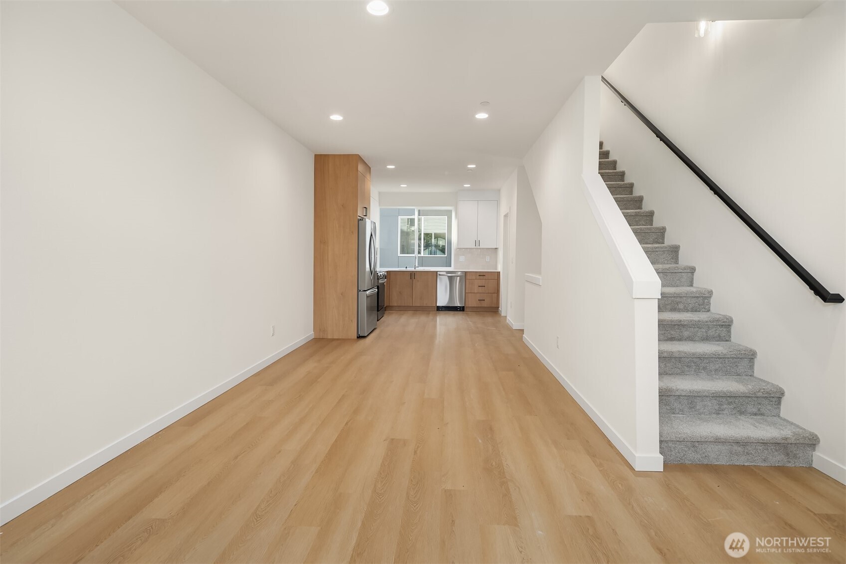 18017 2nd Avenue Northeast, Unit B Seattle, WA 98155 - Photo 10 of 19 a view of a room with wooden floor and stairs