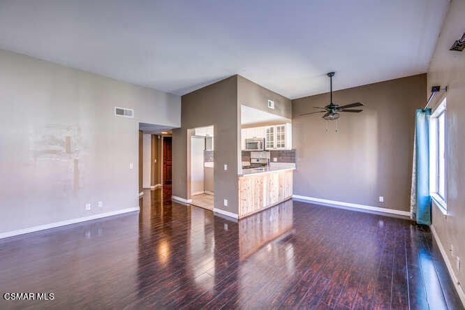 1766 Sinaloa Road, Unit 279 Simi Valley, CA 93065 - Photo 14 of 23 a view of an empty room with wooden floor and a window