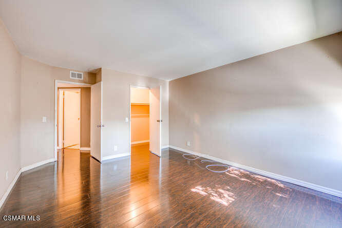 1766 Sinaloa Road, Unit 279 Simi Valley, CA 93065 - Photo 15 of 23 a view of empty room with wooden floor