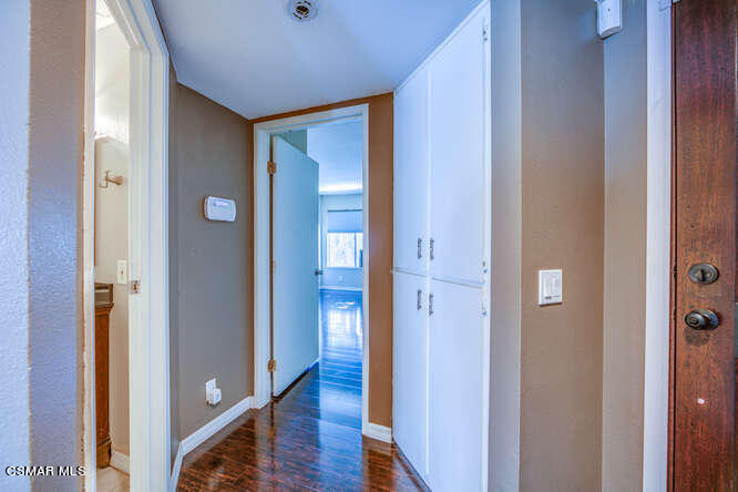 1766 Sinaloa Road, Unit 279 Simi Valley, CA 93065 - Photo 19 of 23 a view of a hallway with wooden floor