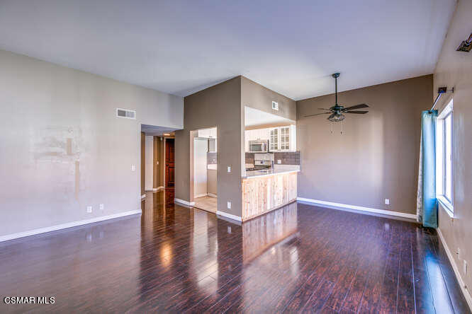 1766 Sinaloa Road, Unit 279 Simi Valley, CA 93065 - Photo 9 of 23 a view of an empty room with wooden floor and a window
