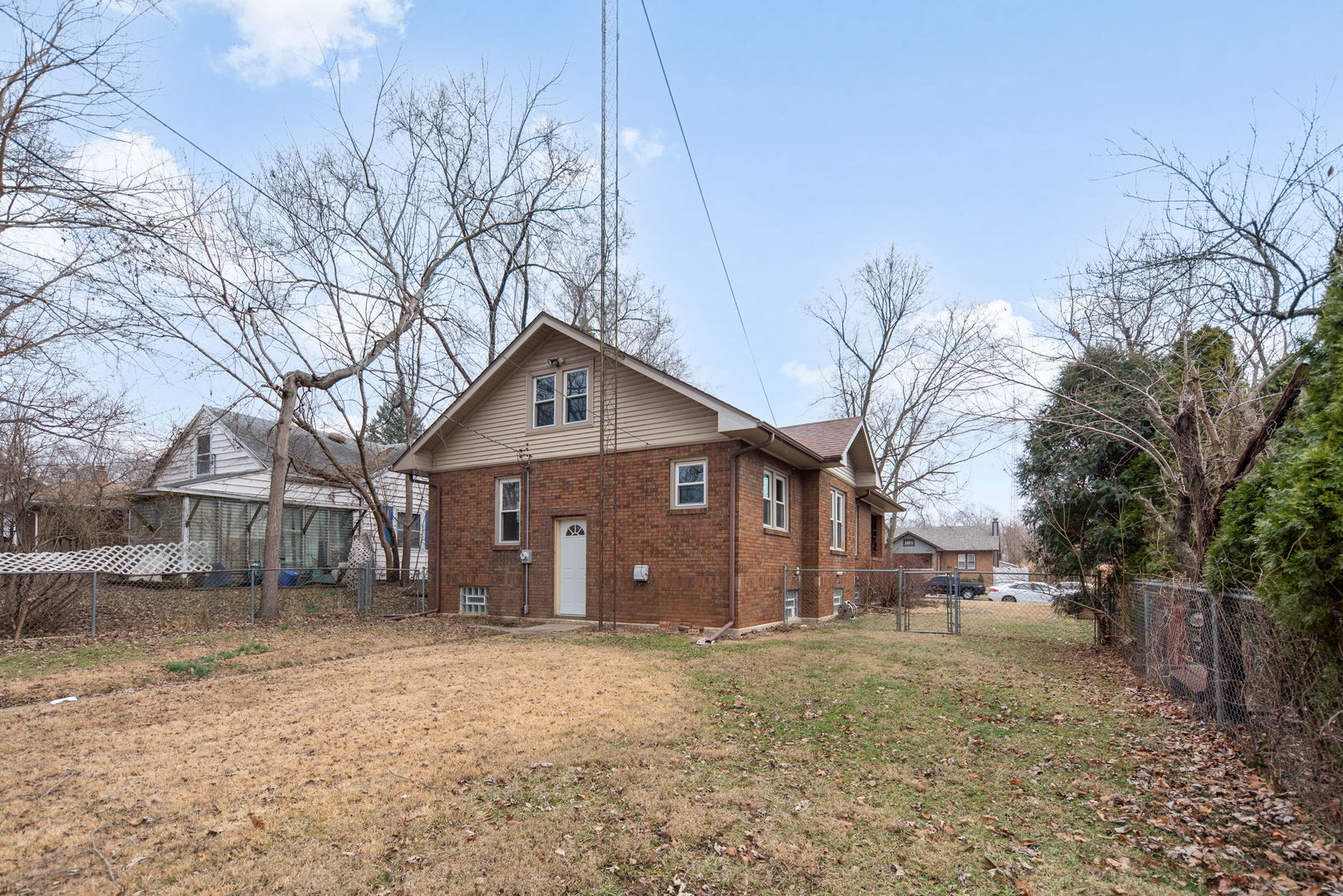 1065 South Poplar Avenue Kankakee, IL 60901 - Photo 16 of 17 a view of a house with a yard covered in snow