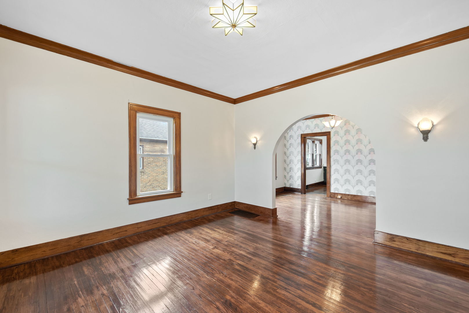 1065 South Poplar Avenue Kankakee, IL 60901 - Photo 5 of 17 a view of empty room with wooden floor and fan