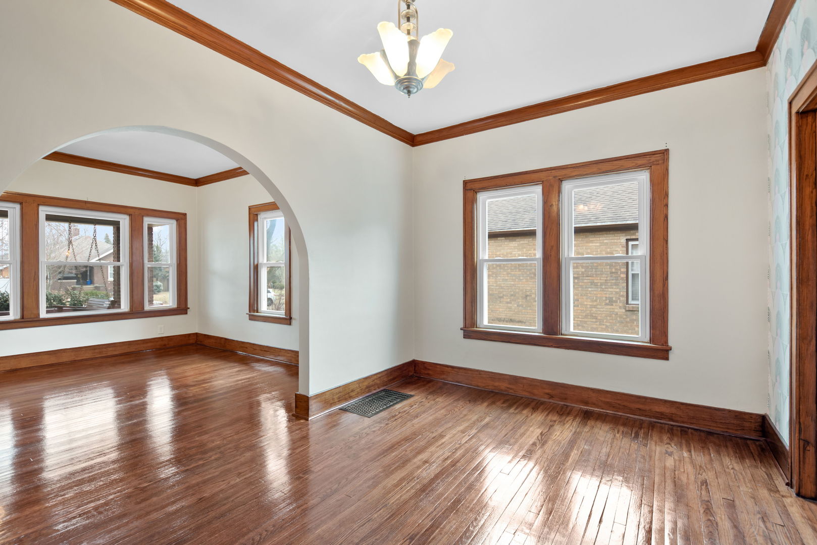 1065 South Poplar Avenue Kankakee, IL 60901 - Photo 6 of 17 a view of an empty room with wooden floor and a window