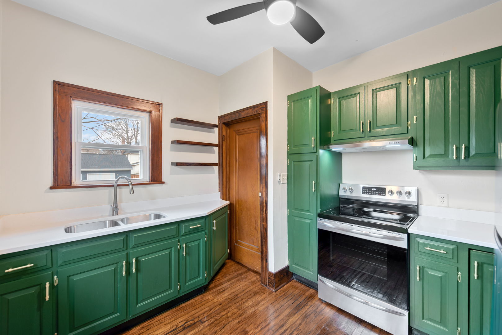 1065 South Poplar Avenue Kankakee, IL 60901 - Photo 9 of 17 a kitchen with sink cabinets and wooden floor