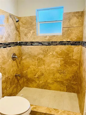 a bathroom with a toilet and a sink