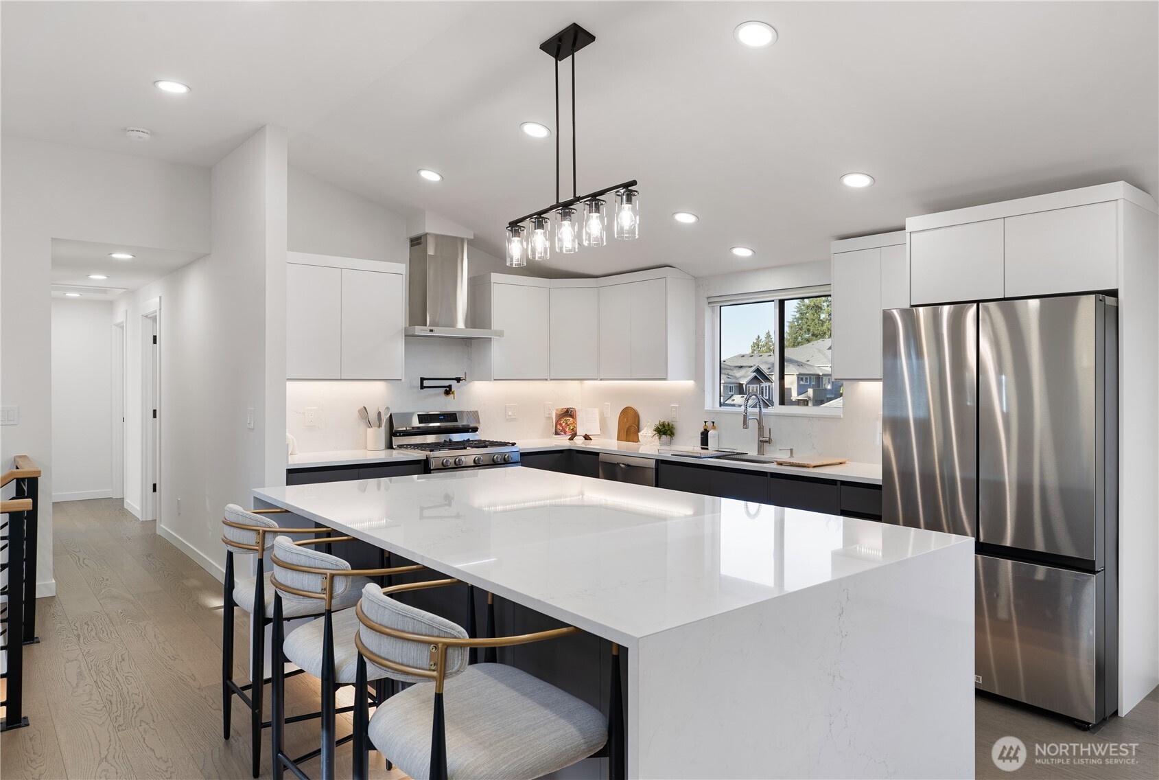 4215 228th Street Southeast Bothell, WA 98021 - Photo 12 of 36 a large kitchen with a table and chairs