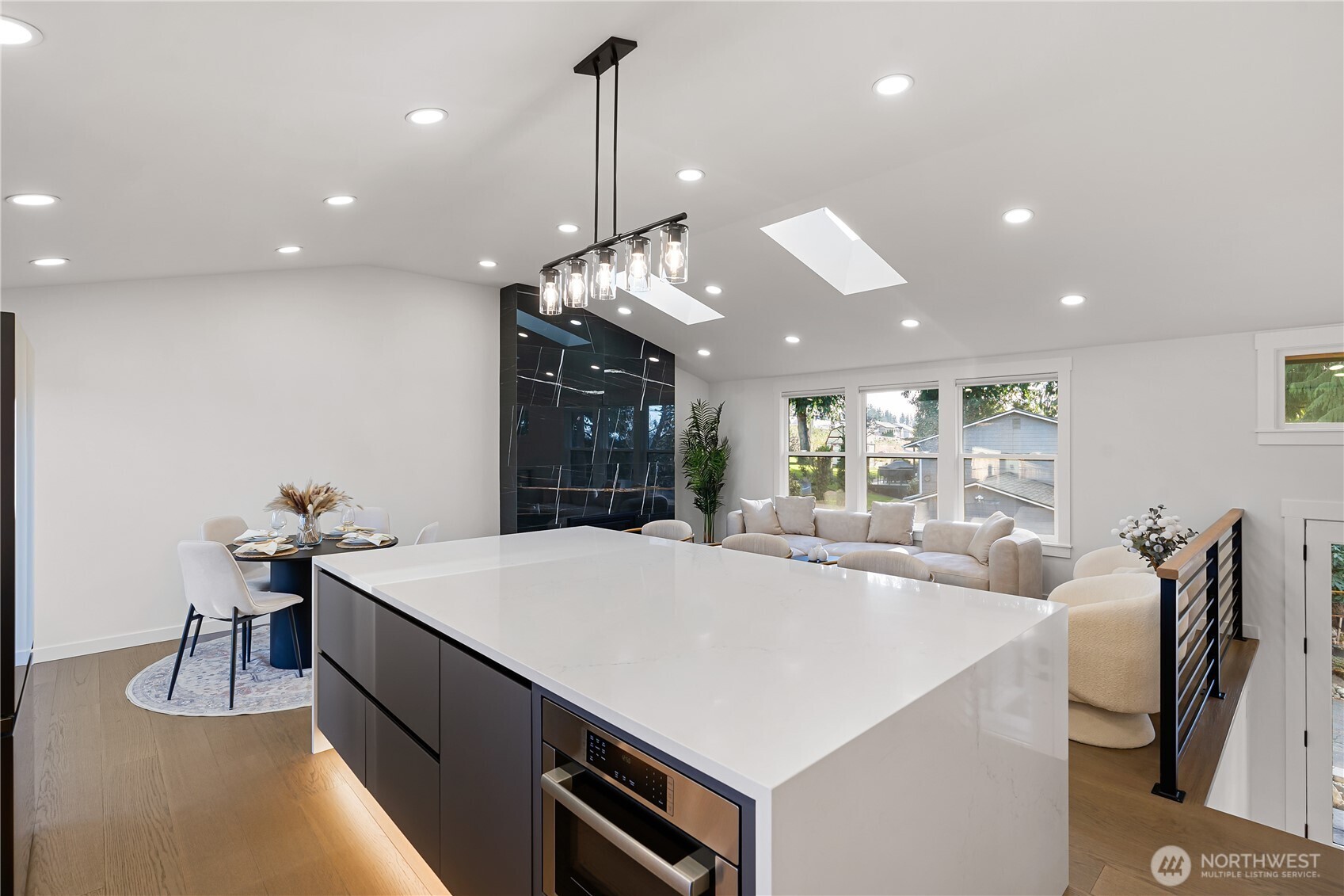 4215 228th Street Southeast Bothell, WA 98021 - Photo 14 of 36 a large kitchen with kitchen island a large island in it