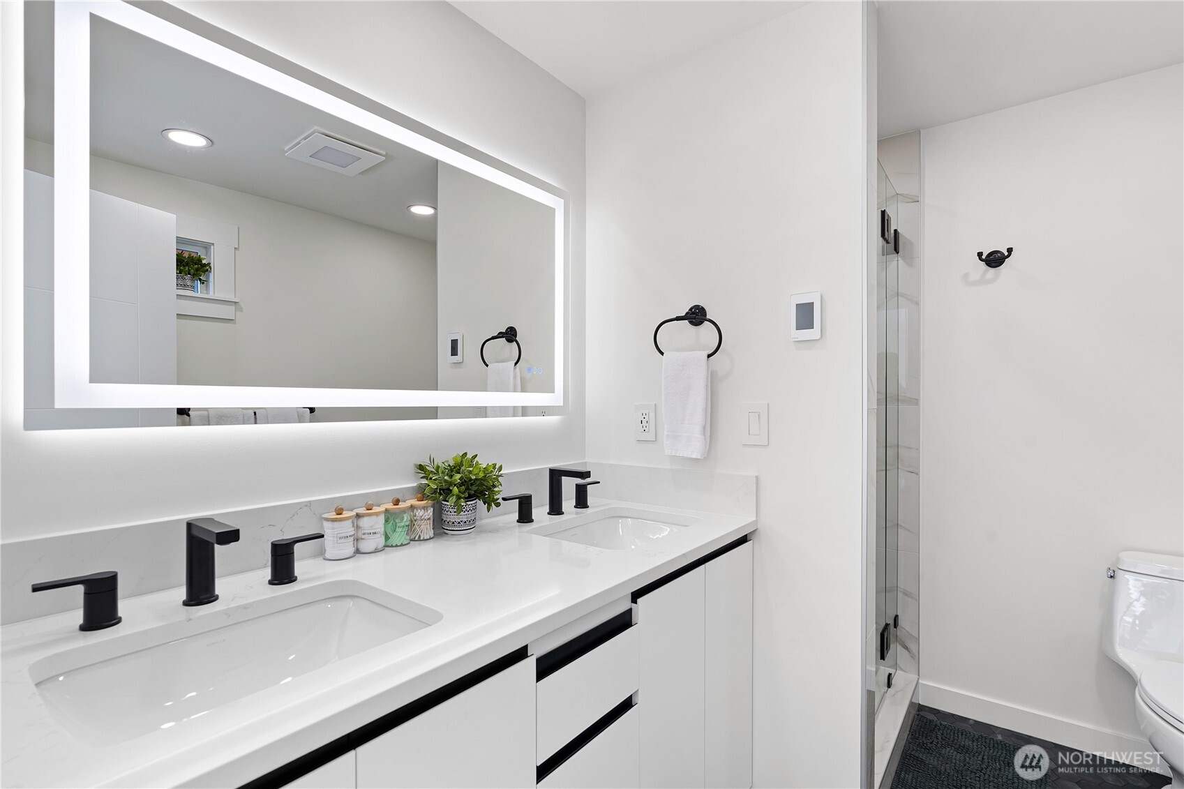 4215 228th Street Southeast Bothell, WA 98021 - Photo 18 of 36 a bathroom with a sink and a mirror