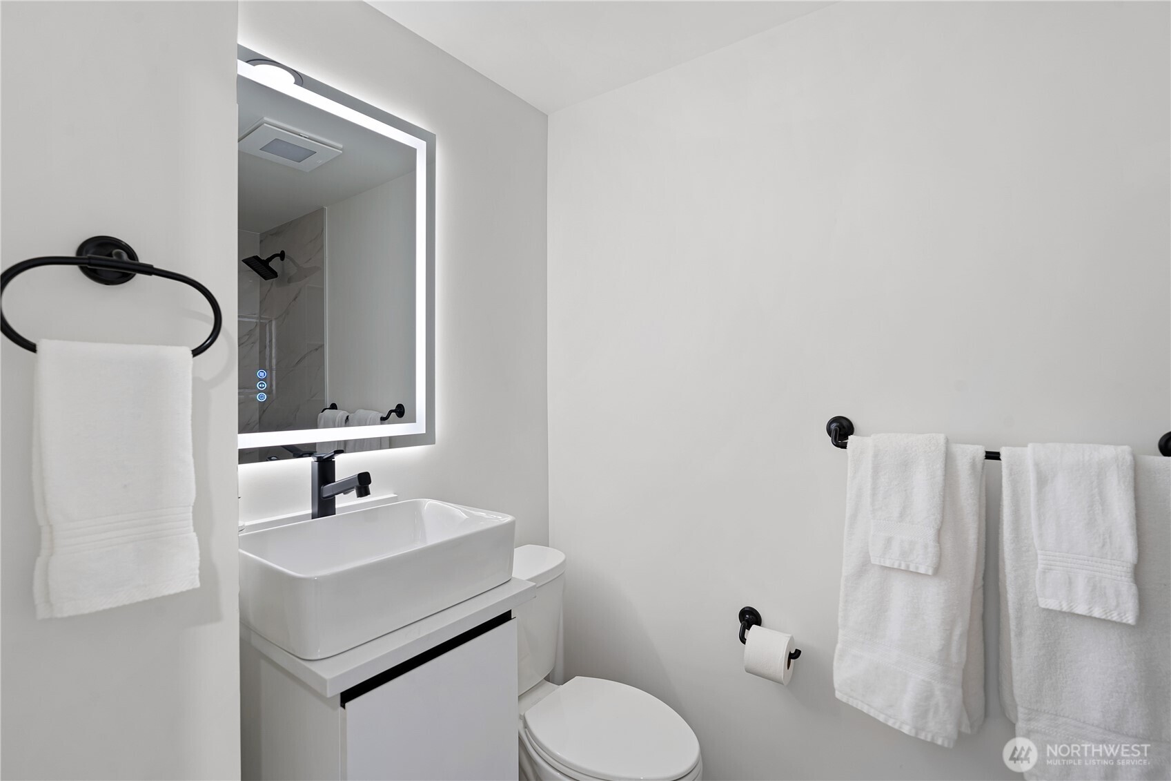 4215 228th Street Southeast Bothell, WA 98021 - Photo 21 of 36 a bathroom with a toilet sink and mirror